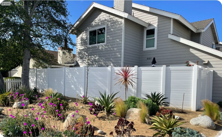 vinyl privacy fence on the side of a house