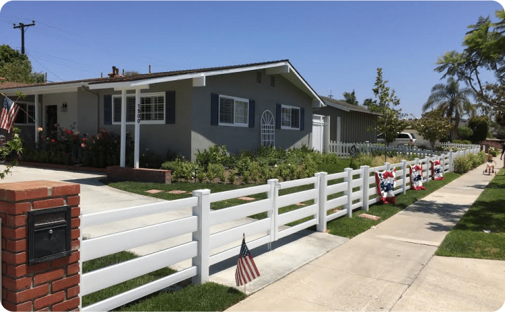 Vinyl fence and gate with American flags